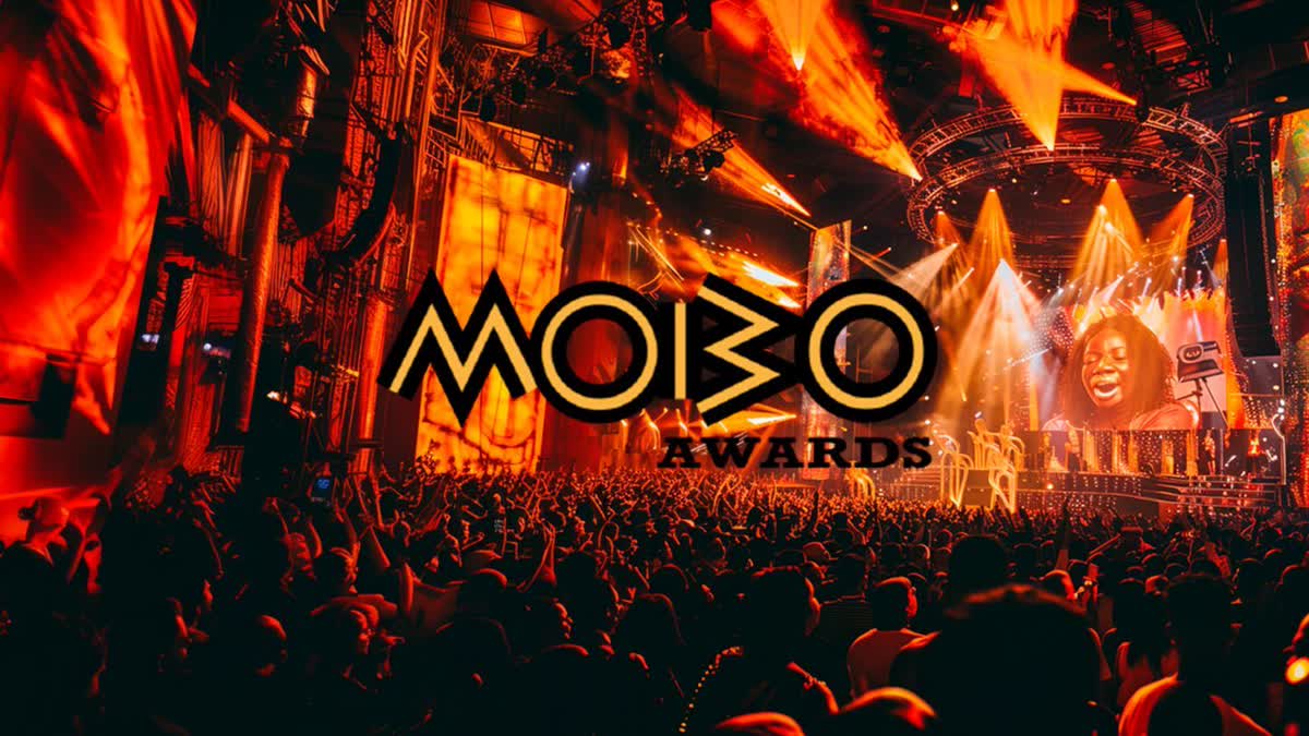 MOBO Awards logo over a packed arena with orange stage lights